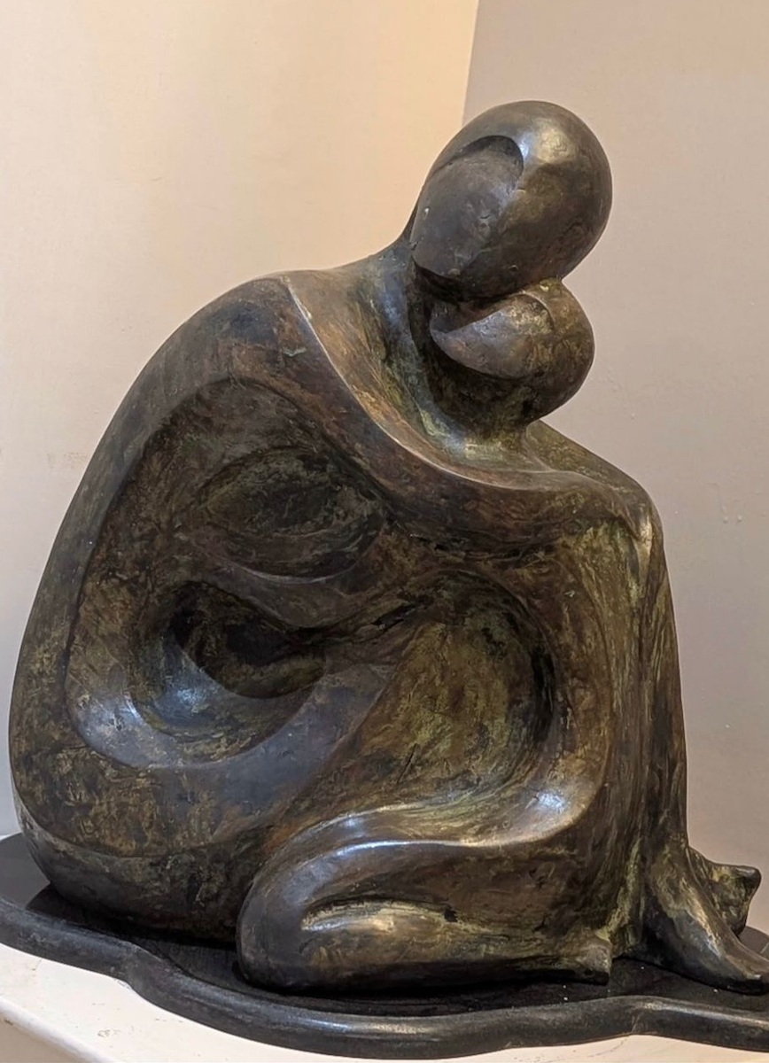 Bronze sculpture by Gauri Verma depicting couple in embrace.
