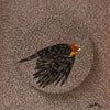 Artistic depiction of a bird with a red and yellow head on a textured brown background