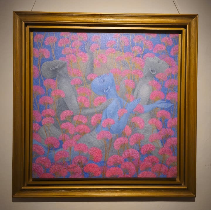 Framed Art picture of Kamar Alam's meditative art; three floating humans in pink flower field.