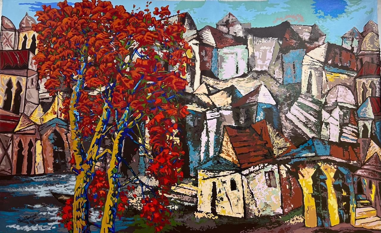 Red blooming tree takes centrestage in Acrylic cityscape painting by Fawad Tamkanat.
Fawad creating whimsical seaside towns which bring together a harmony in architecture of both Indian and European towns. 