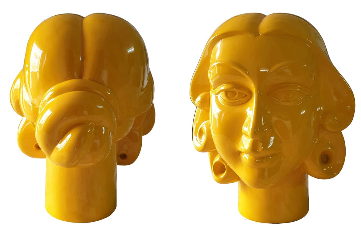 D.V.S. Krishna original glossy yellow fiberglass woman portrait sculpture featuring a gentle smile with curly locks framing her face