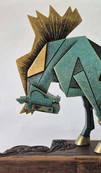 Close-up detail of horse sculpture by Dinkar Jadhav: Flying golden mane and gently tilted head profile.