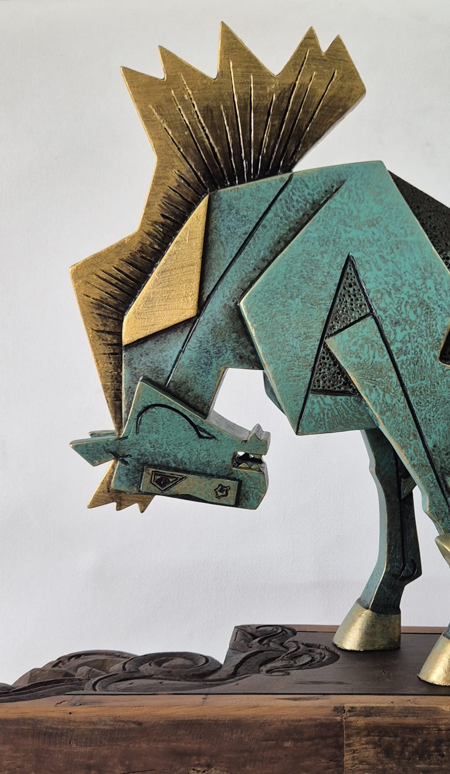 Close-up detail of horse sculpture by Dinkar Jadhav: Flying golden mane and gently tilted head profile.