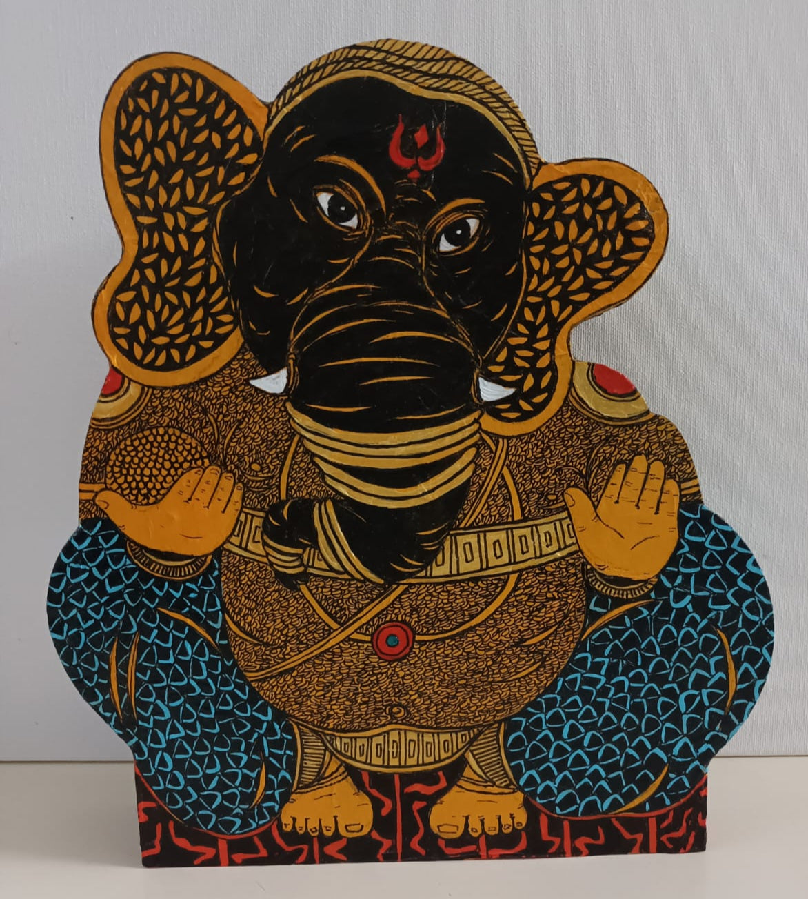 Ramakrishna Vasanthula wooden sculpture feautring the revered Lord Ganesha. Wooden sculptures with detailing on front side visible in pic.