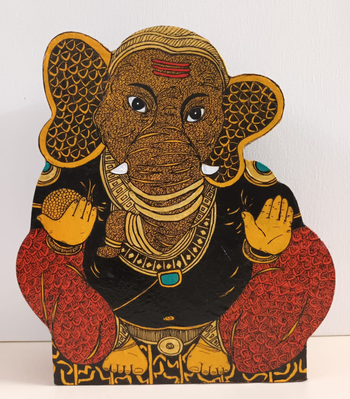 Decorative Sculpture of Lord Ganesha with intricate patterns on all visible sides.