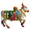 Colorful cow statue with artistic depiction on a white background of Gods in body.