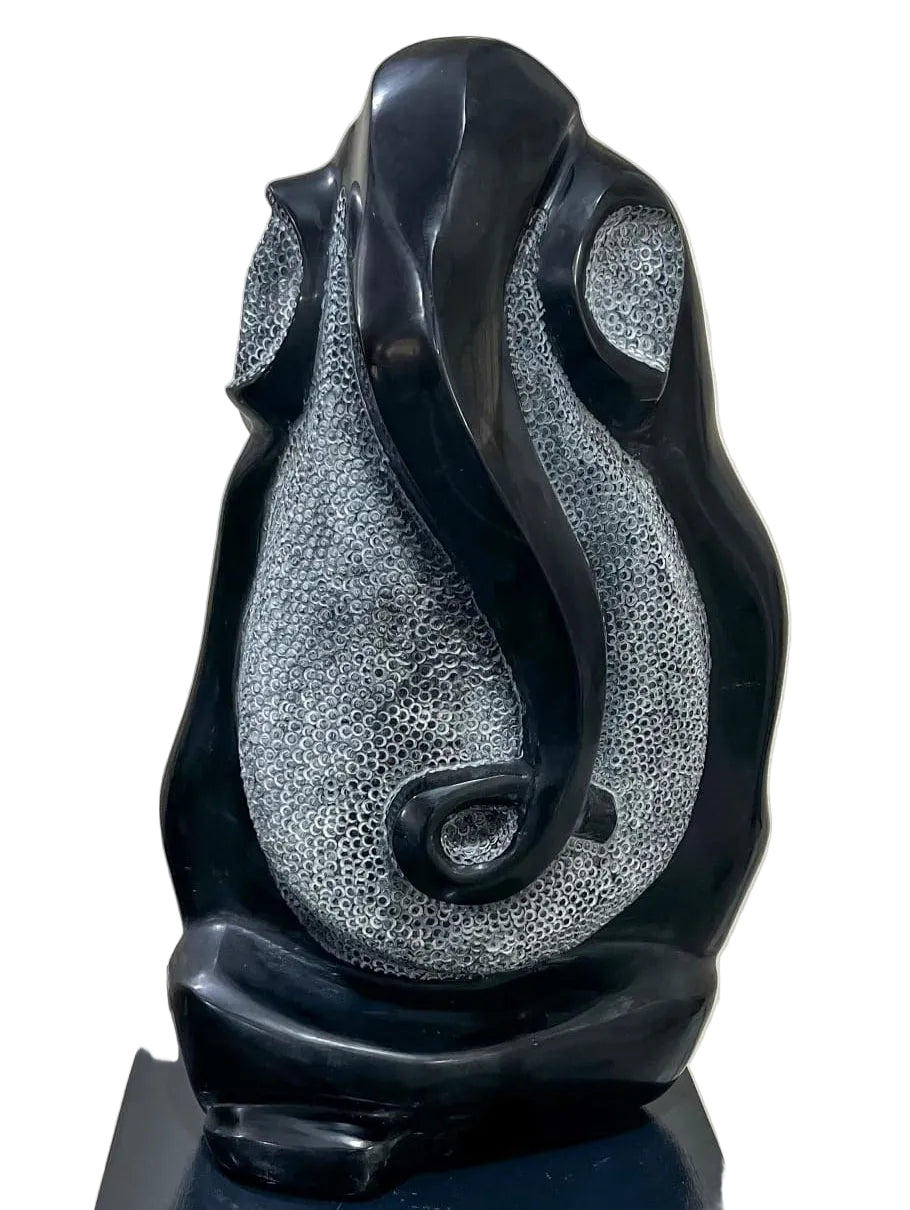 Ram Bali Prajapati gemstone Lord Ganesha sculpture with polished trunk and textured ears. Material is black obsidian 