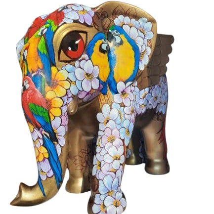 Right side diagnol view of Gold elephant sculpture Maharaja by Sachindra Nath Jha, showcasing painted birds and floral body.