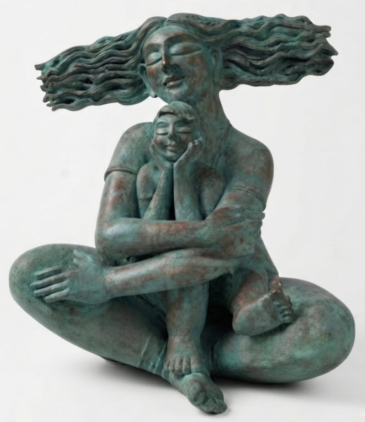 A bronze sculpture of a seated mother holding a child in bliss, with hair flowing like waves.