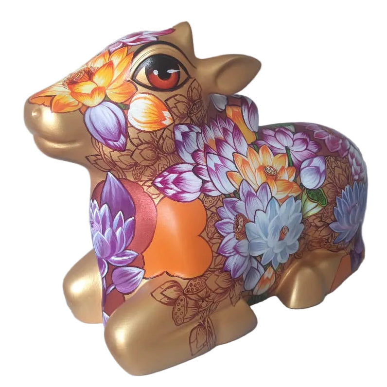 Right Side view of Nandi gold tone  fiberglass sculpture by Sachindra Nath Jha, painted with dense colorful flora.