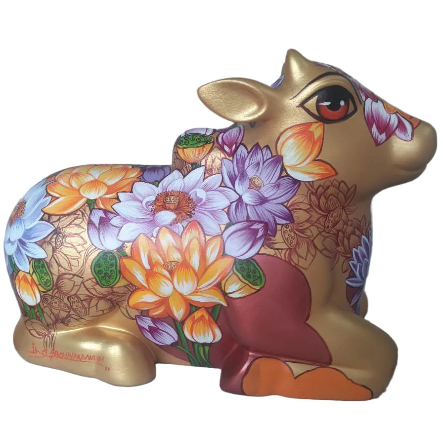 Gold tone fiberglass Nandi sculpture by Sachindra Nath Jha, painted with floral ornamentation and humped back