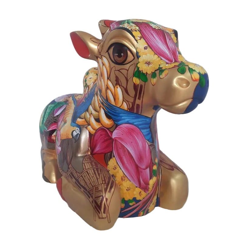 Front view of Nandi sculpture by Sachindra Jha: Vibrant gold tone fiberglass Nandi sculpture painted with lush Madhubani floral patterns.