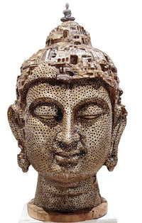 Pintu Sikder sculpture of a Buddha head with intricate detailing on a head. 