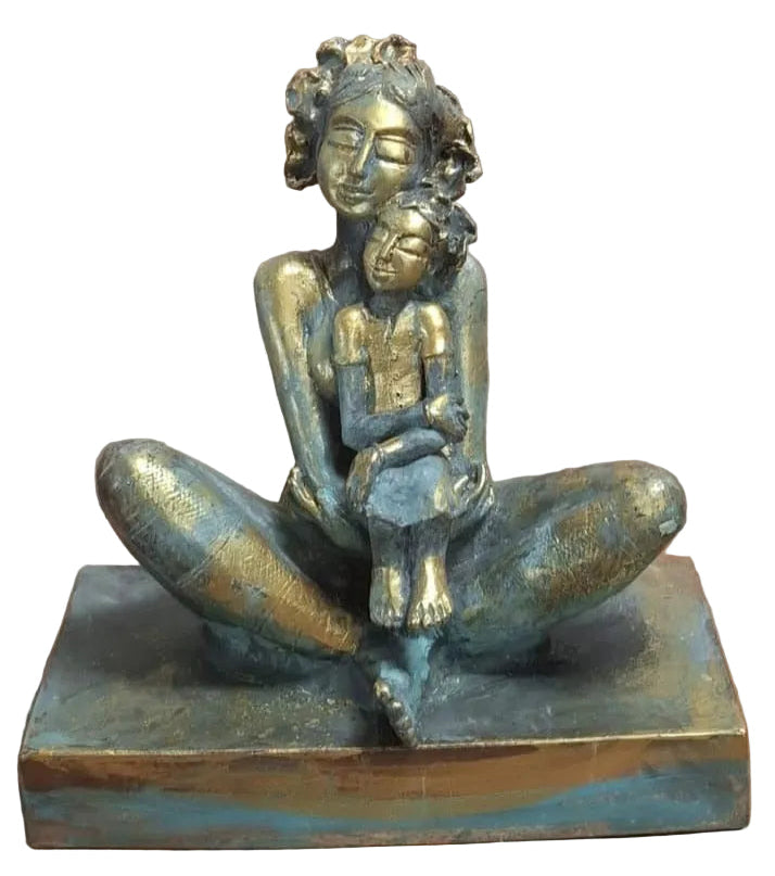 P. Gnana bronze sculpture of mother and child. the girl child smiles as she rests in her mother's lap