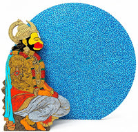 Ramakrishna Vasanthula hand-painted wooden sculpture of Lord Hanuman against a bright blue moon.