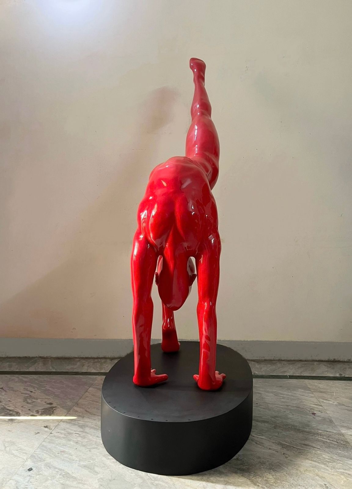 Side image of Vernikas singh inverted yoga sculpture