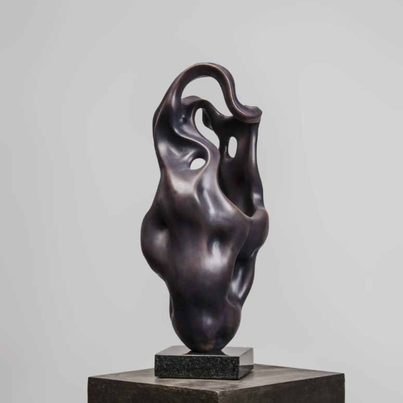 Exclusive sculpture features a unique, modern fluid design that breathes life and motion into copper and composite.