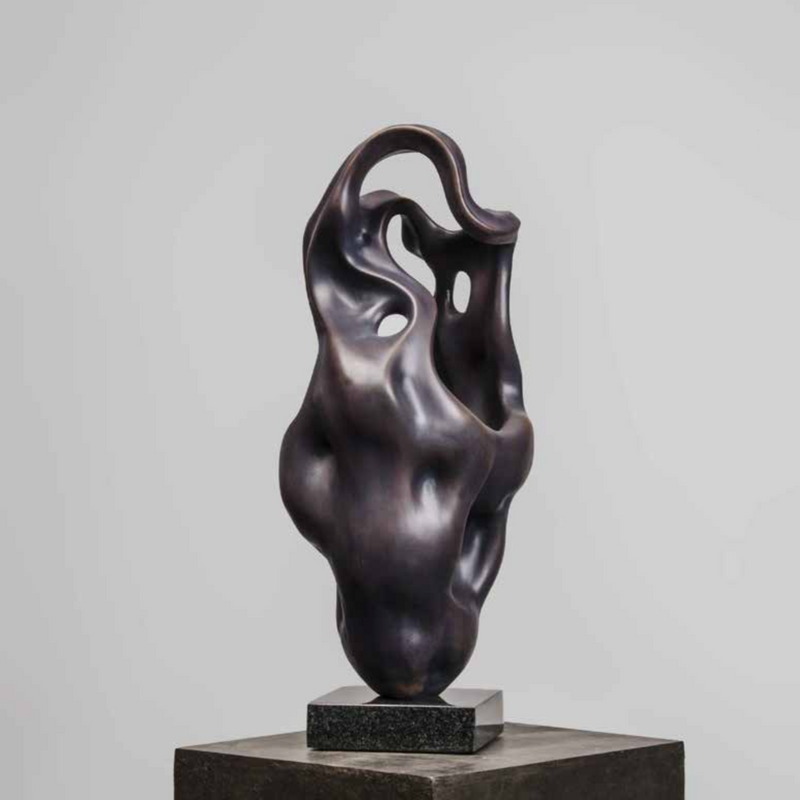 Exclusive sculpture features a unique, modern fluid design that breathes life and motion into copper and composite.