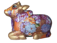 Side view of large decorative Nandi fiberglass sculpture by Sachindra Nath Jha; the bull is painted in colorful flora and folk-art back patterns