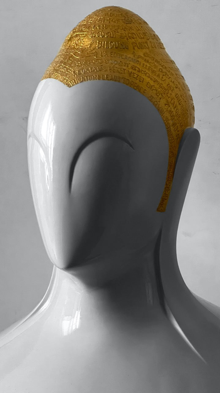 Right Side profile of Sangeeta Abhay Swarnakshara Buddha sculpture in white and gold.