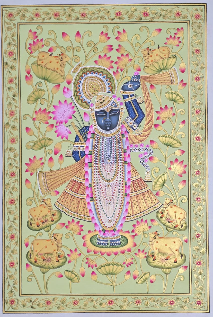 Traditional Lord Shrinath ji Pichwai painting  in soft hues. The deity is adorned in fine native jewels and attire and stands admist lotus blooms.
