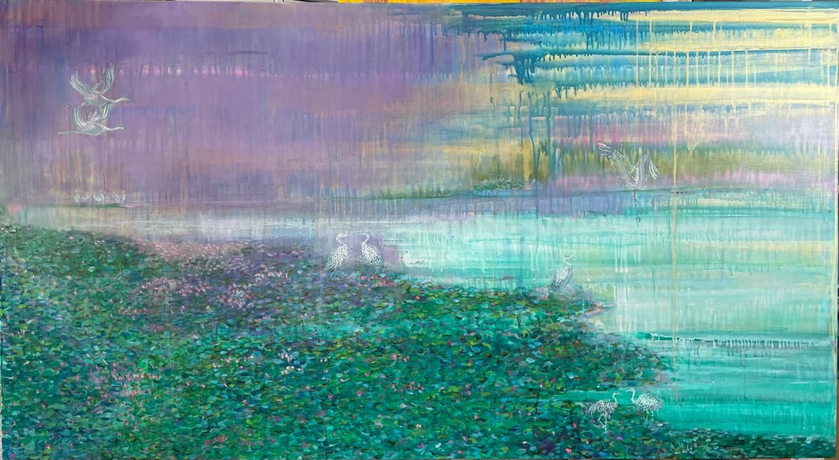 Nature landscape painting with a gradient of blue, green, and lavender hues. Cranes fly over blooms and pond. 