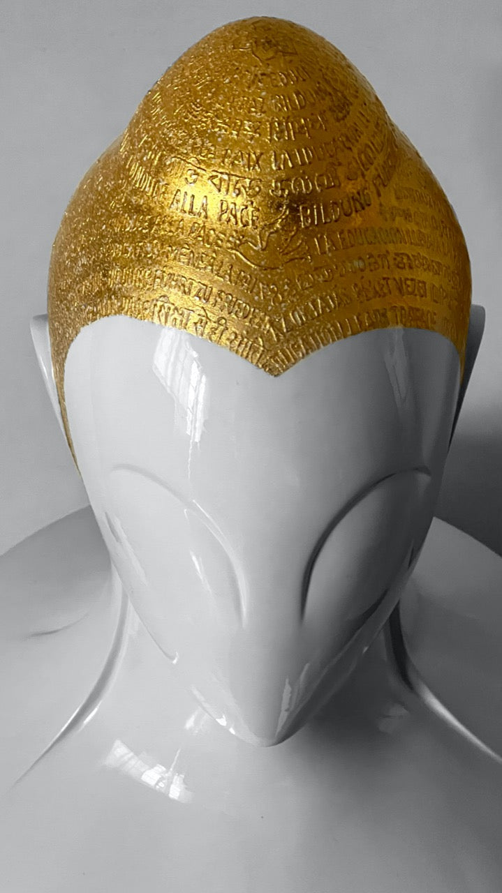Top view of gold-finished head on  Buddha sculpture by Sangeeta Abhay.