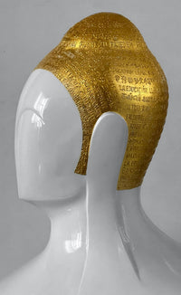 Side profile of Sangeeta Abhay Swarnakshara Buddha sculpture in white and gold.