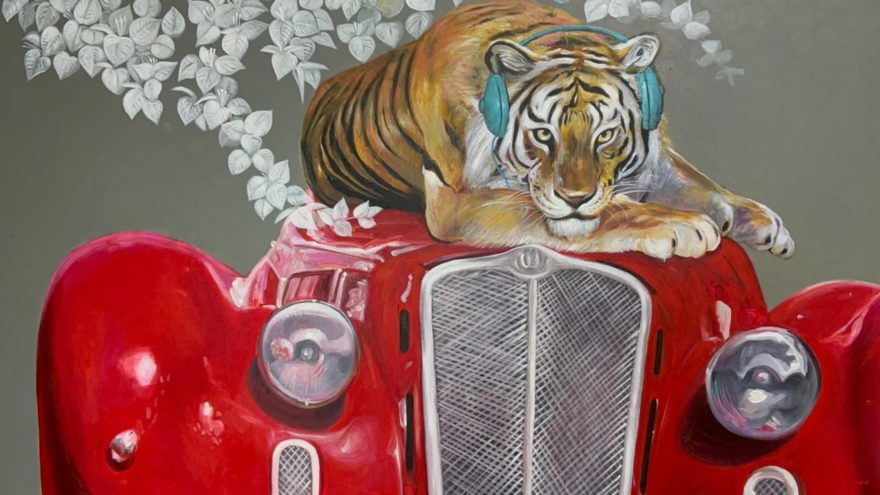 Jiban Biswas canvas painting of a tiger with blue headphones seated on a vintage red car.