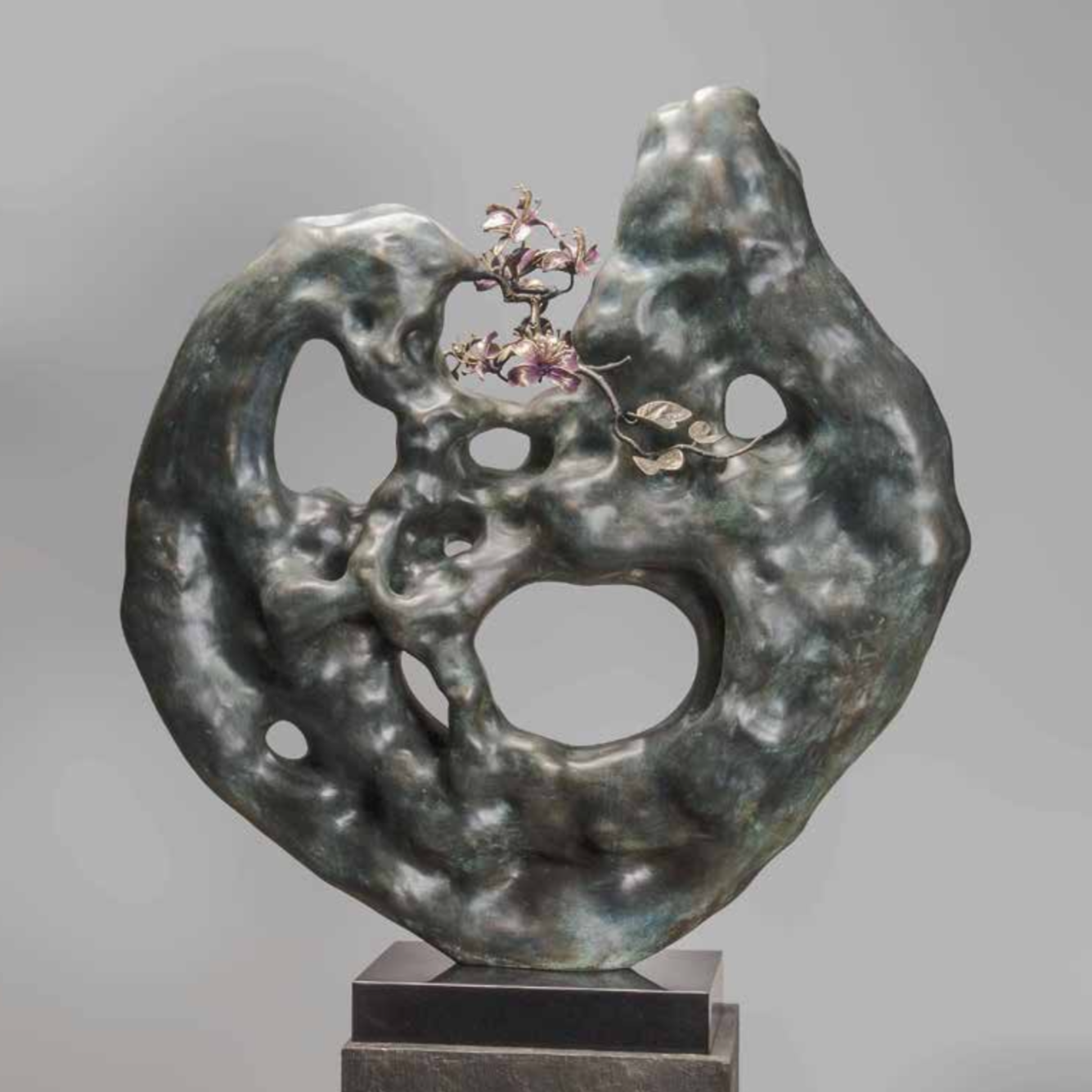 The New Beginning sculpture by Divyendu Anand features flowers blossoming from rock crevices.