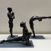 Set of Three Men in Surya Namaskar Poses. Details Listed below:
The equestrian pose, the Prayer pose and 
Raised Arms pose. Black finish. 