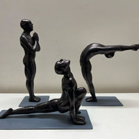 Set of Three Men in Surya Namaskar Poses. Details Listed below:
The equestrian pose, the Prayer pose and 
Raised Arms pose. Black finish. 