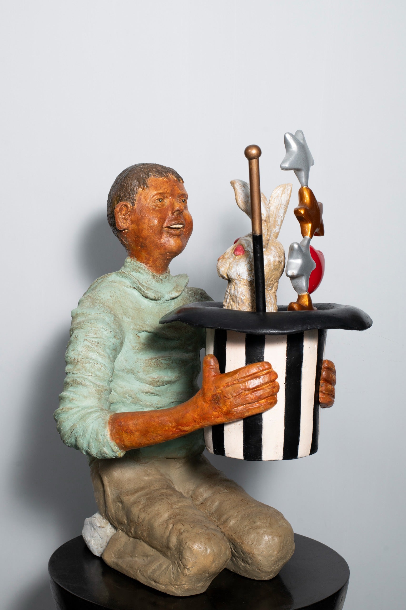 Tapasya Gupta fiberglass magician sculpture; a rabbit pops out of magic hat.